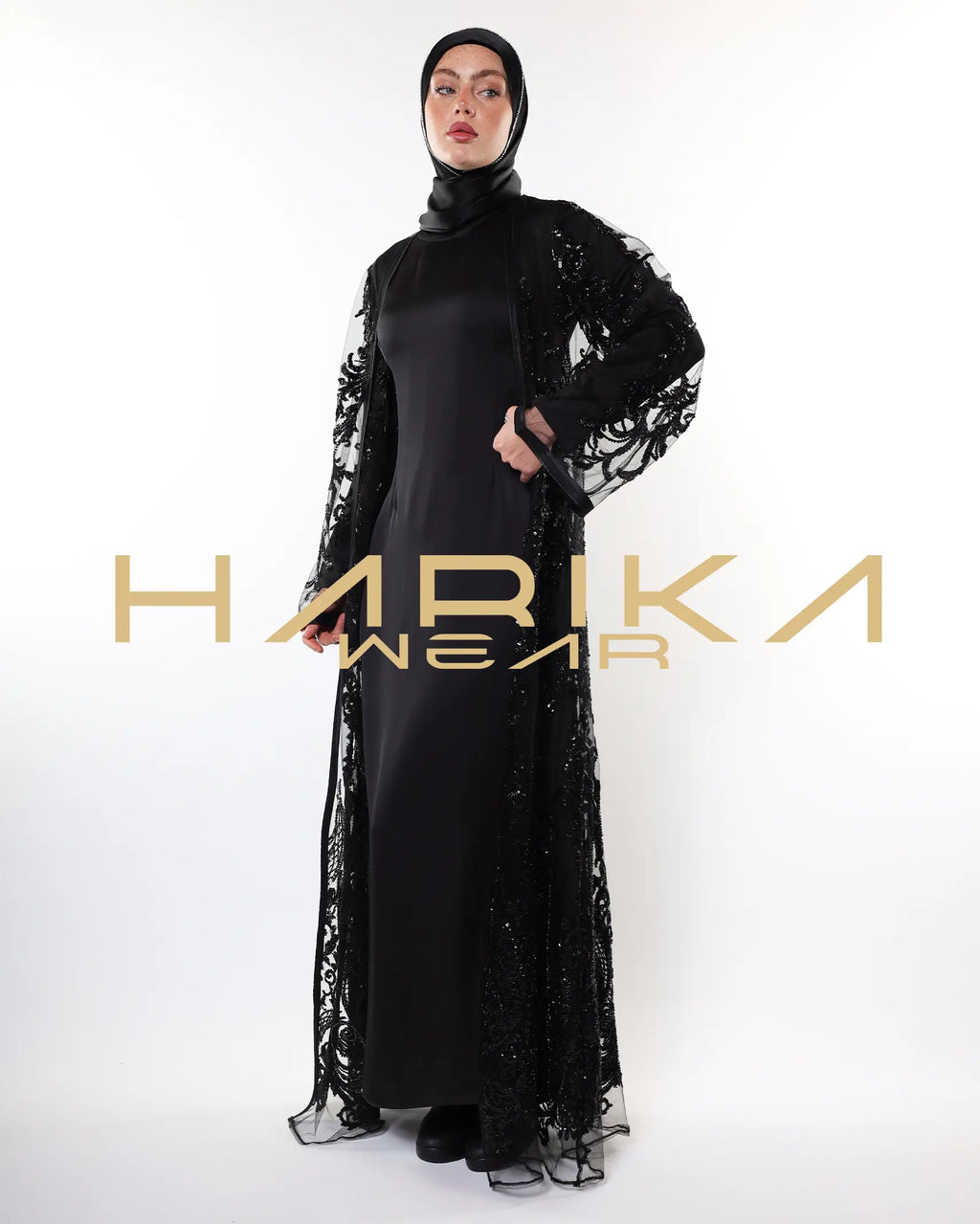 Black abayas designed from tulle fabric embroidered with shiny crystals