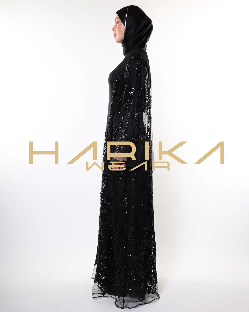 Black abayas designed from tulle fabric embroidered with shiny crystals