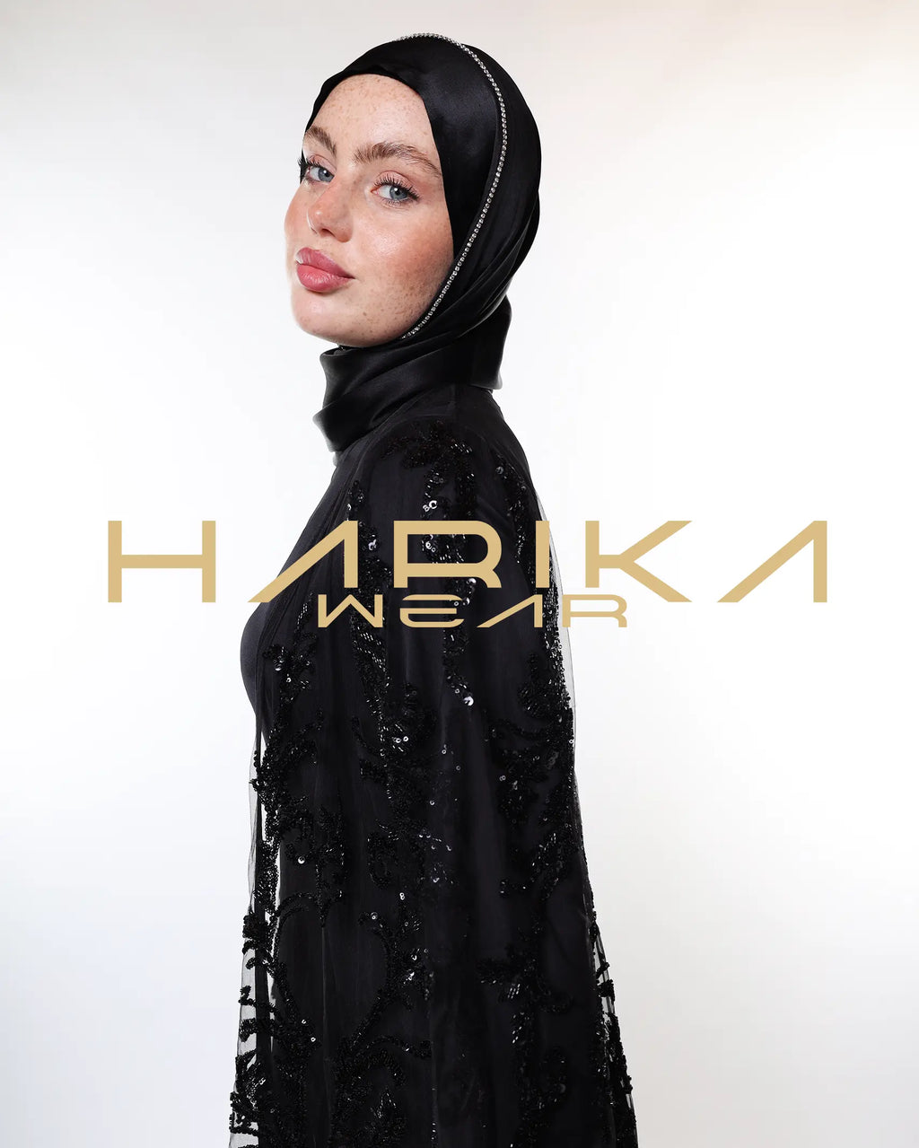 Black abayas designed from tulle fabric embroidered with shiny crystals