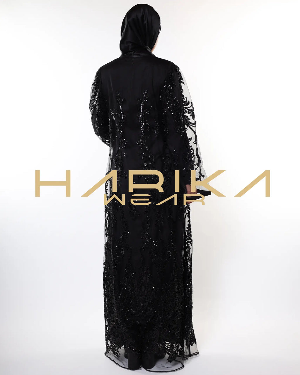 Black abayas designed from tulle fabric embroidered with shiny crystals