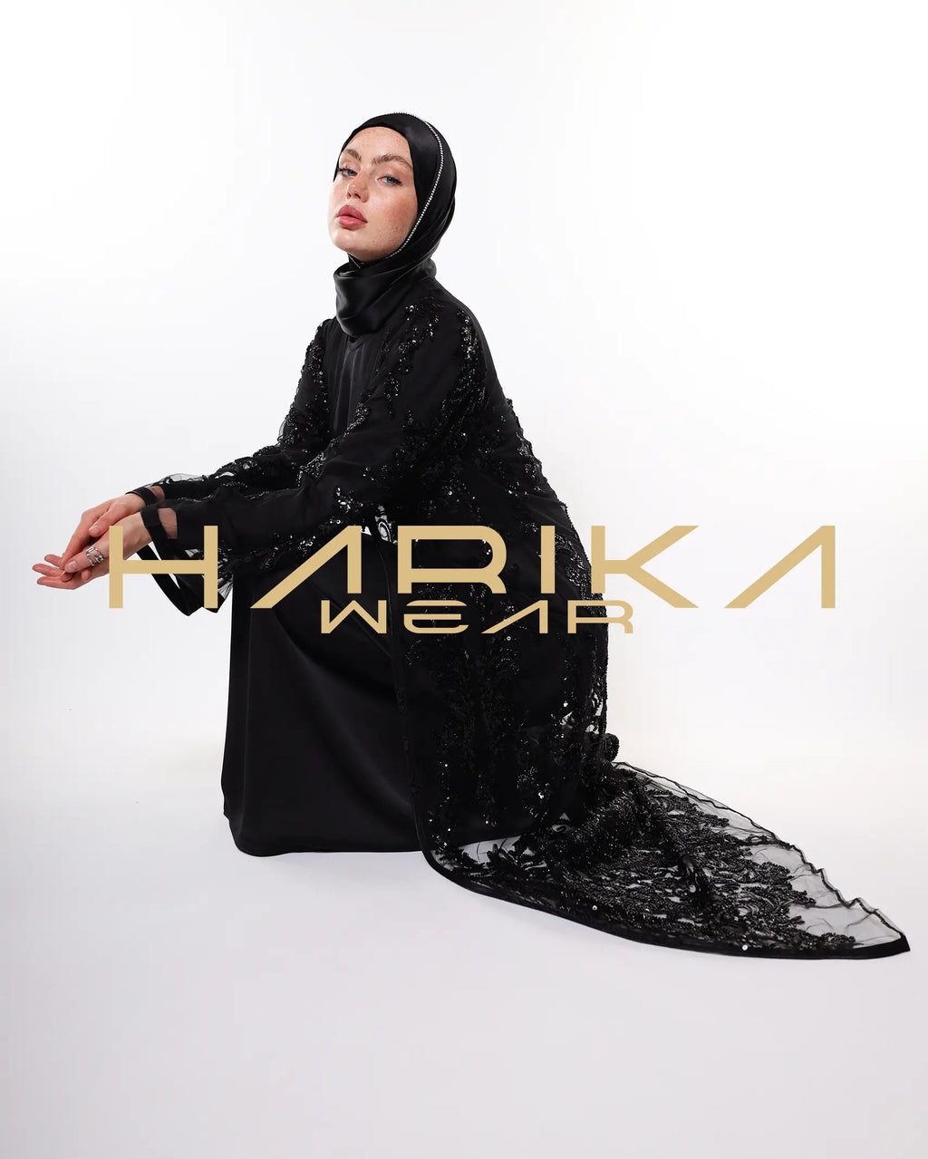 Black abayas designed from tulle fabric embroidered with shiny crystals