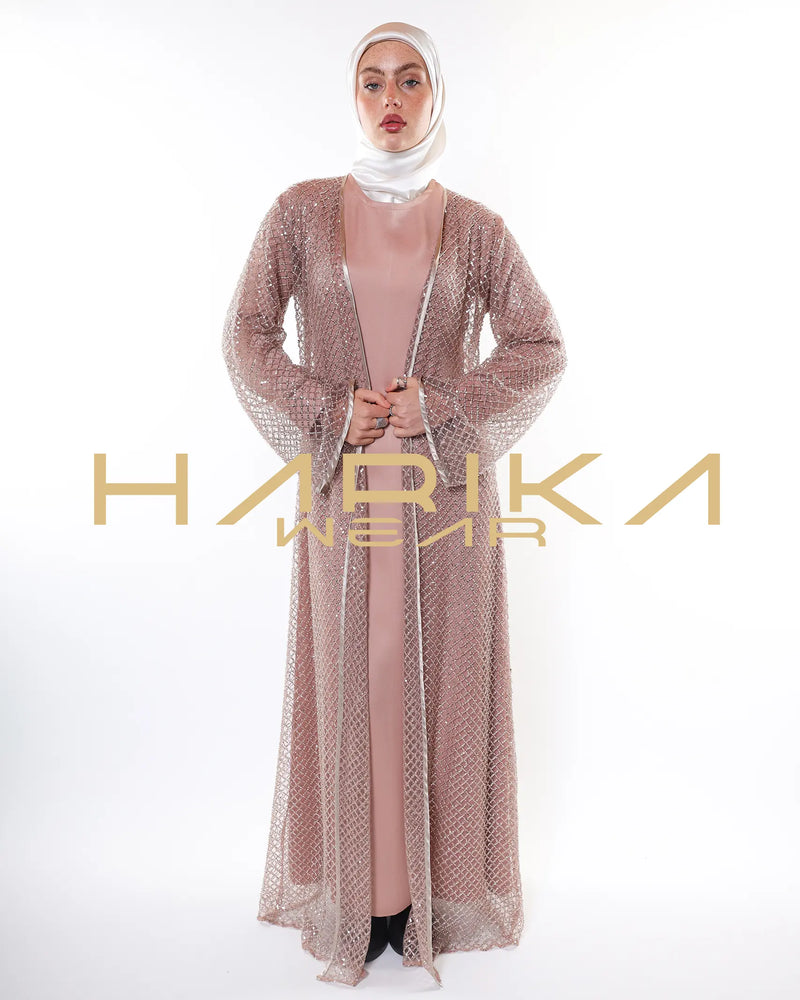 Hand-embroidered gold abayas with crystals